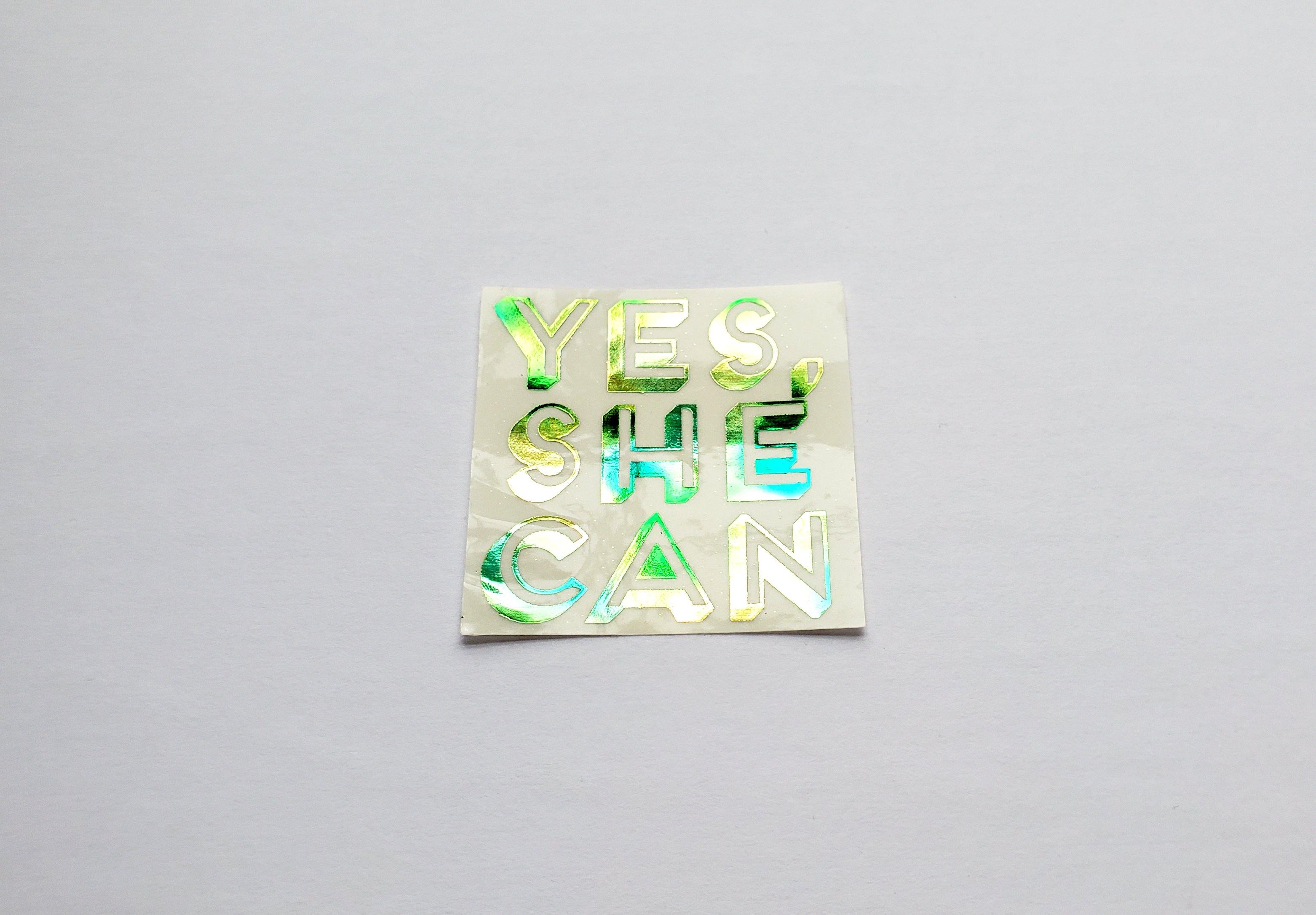 Photo of the Yes, She Can Foiled Sticker in Purple Watercolor by Lucky Dog Design Co.