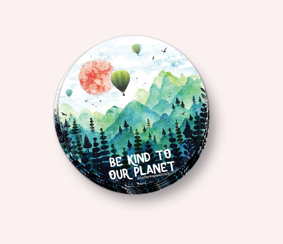Photo of the Be Kind to Our Planet Vinyl Sticker by Lucky Dog Design Co.