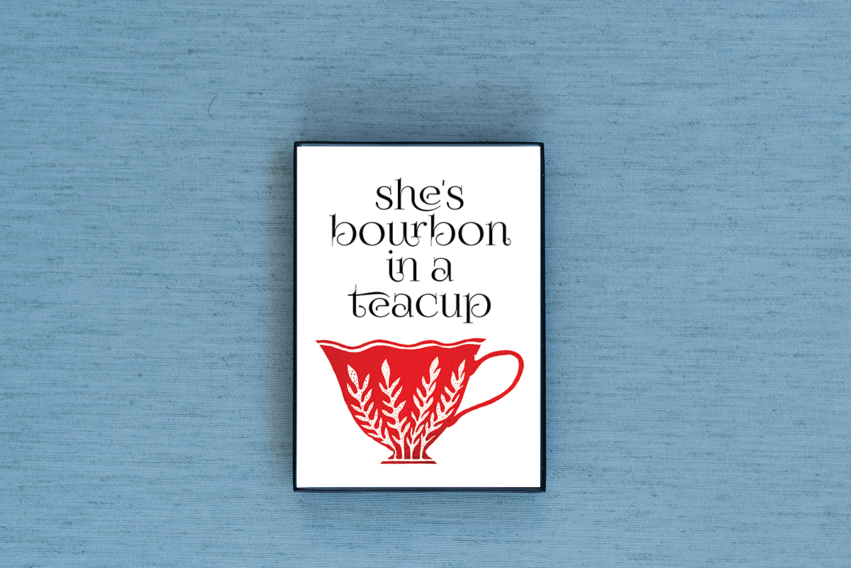 Photo of the She's Bourbon in a Teacup Foiled & Framed Print in Blue by Lucky Dog Design Co.